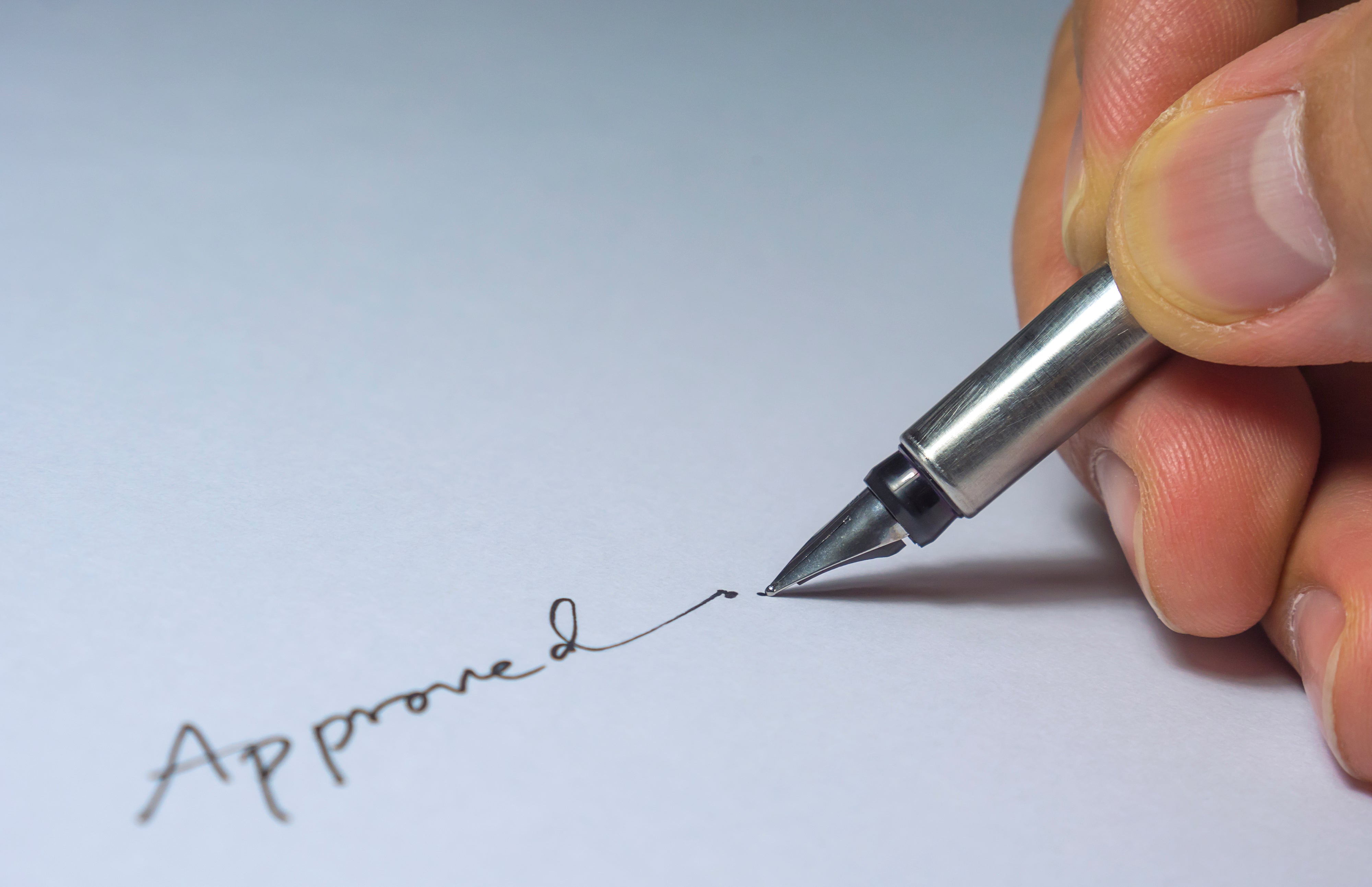 Person writing on elegant writing paper with a luxury fountain pen, highlighting fine writing and best fountain pens
