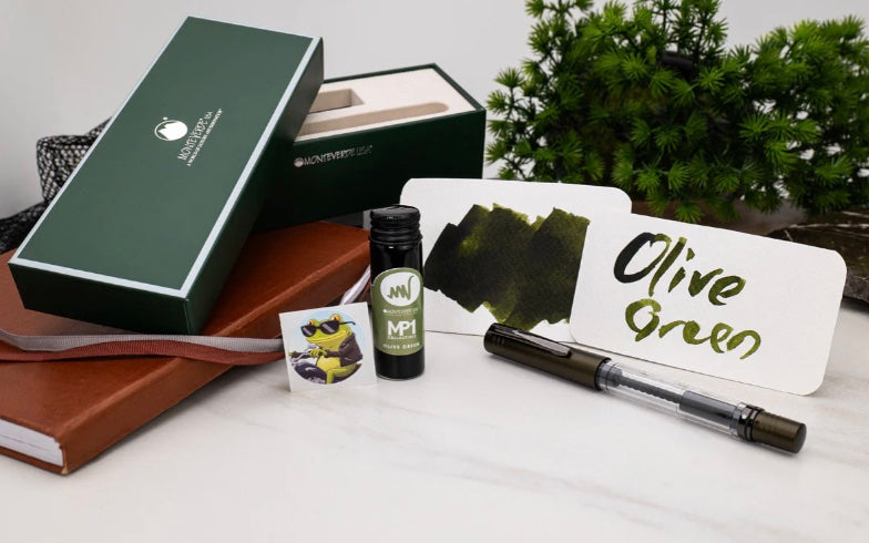 Luxury fountain pen ink set with bottled ink, elegant pen, and writing sample—perfect premium gift for fountain pen lovers.